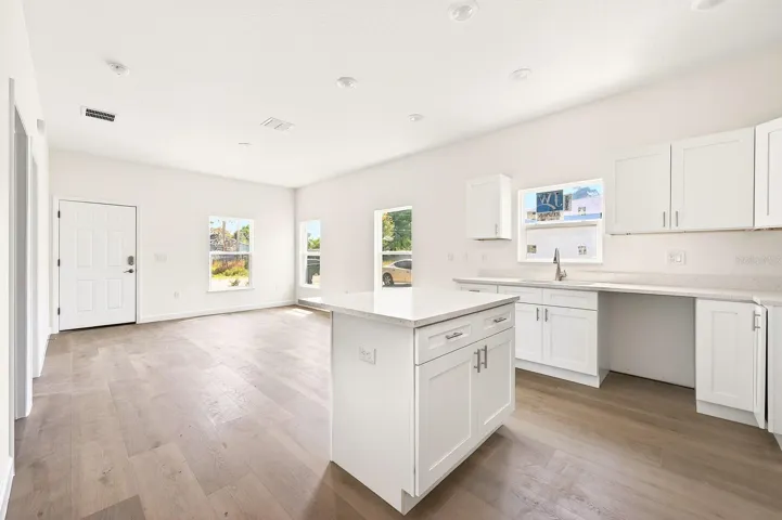 Kitchen is open to the living and dining.