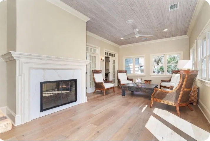 Florida room with double sided fire place