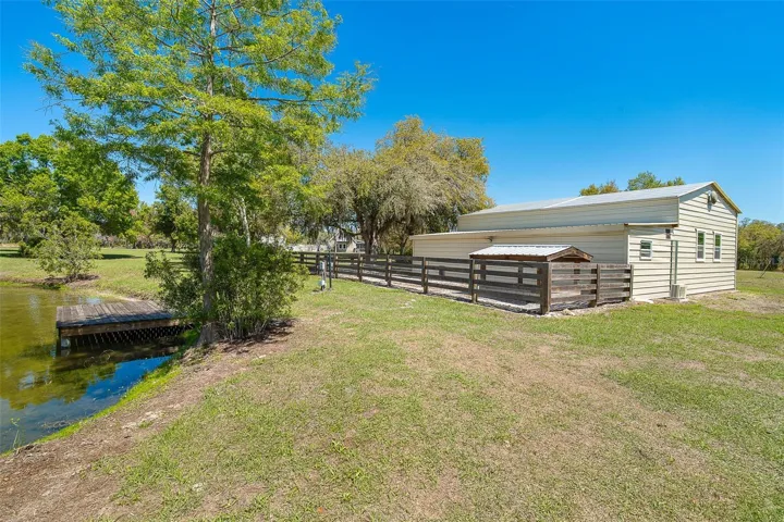 Large garage building with kennels and fenced area