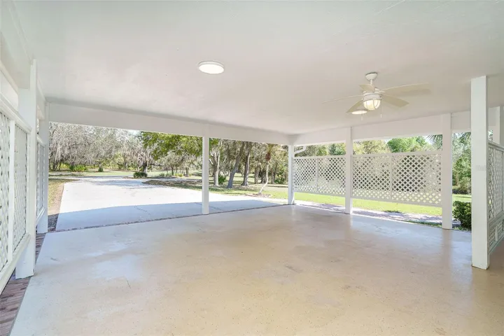 Covered parking area with storage room