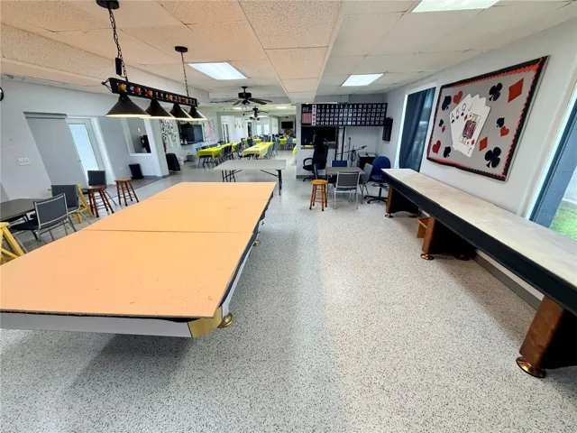 Tennis and shuffleboard tables in clubhouse