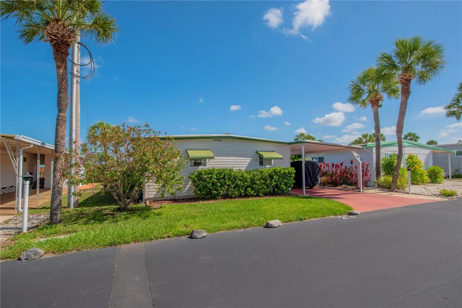 Front of home with tandem carport.