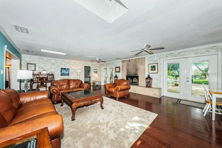 Family room looking out French doors to pool area