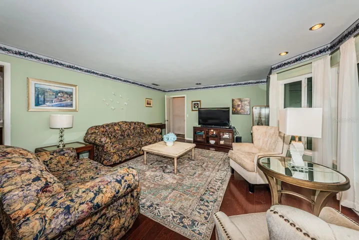 Living room at front of house with lots of windows