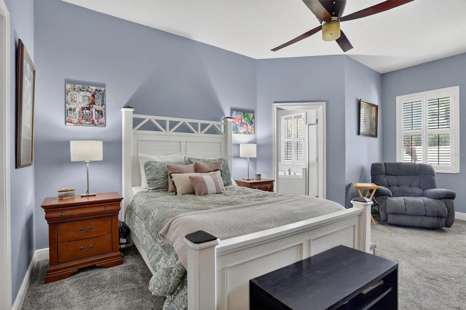 Oversized primary on the first floor with ensuite bath and door leading to lanai.