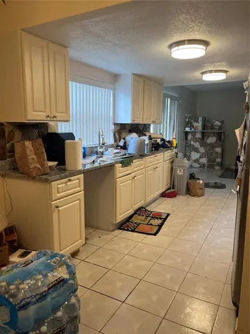 Kitchen space with great footprint and potential—ideal for creating an open, modern design.