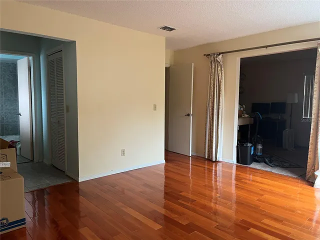 Spacious primary suite with separate sitting area provides flexibility for future design and improved resale appeal after renovation.