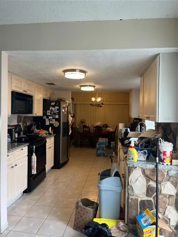 Kitchen layout offers renovation potential for buyers or investors looking to create a more modern, marketable space in Winter Park FL.