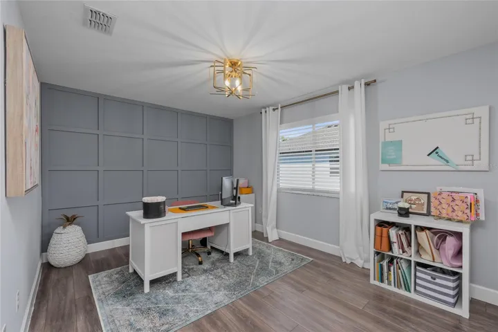 Bedroom 5 with a custom wood accent wall