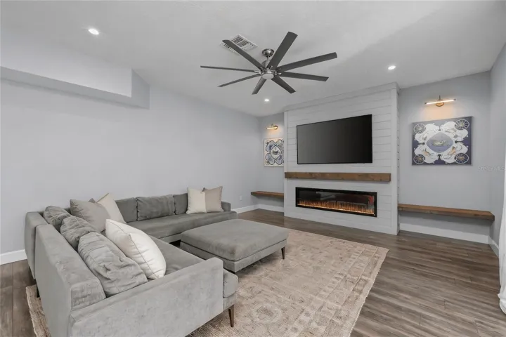 Family Room with accent wall and electric fireplace