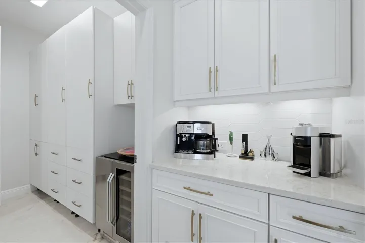 upgraded pantry / laundry room with custom cabinets