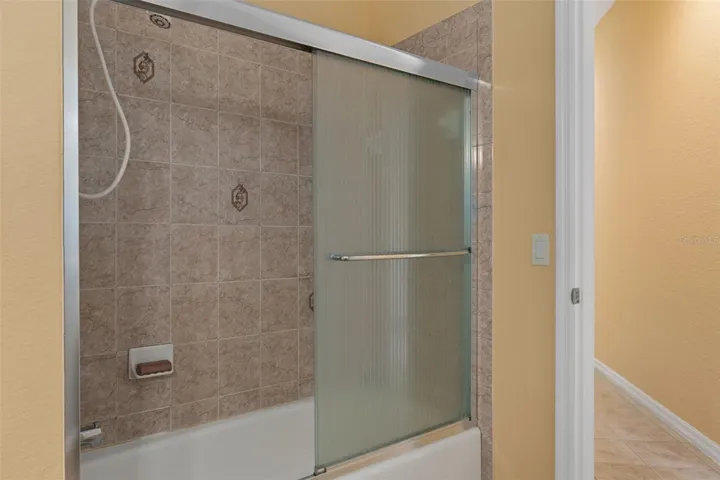There is a Tub/Shower  Combo in the Pool Bathroom that is Beautifully Tiled