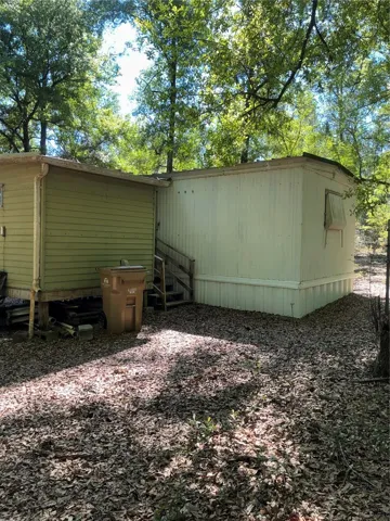 View of storage shed from the opposite side of the yard.