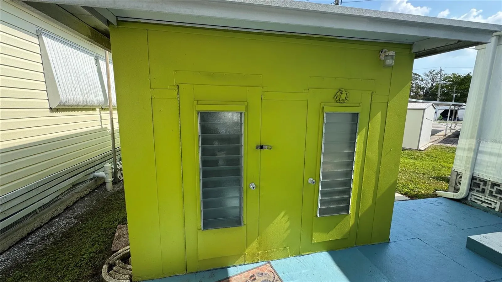 8 ft high Metal Shed 19’ long, 9’wide, and 8’ high with cement floor