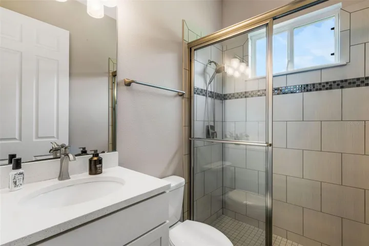 Hall bath just across from door to the Pool