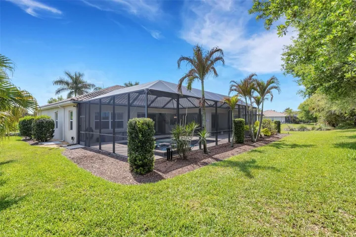 Sitting on a half-acre lot, this home offers privacy and easy-to-maintain landscaping that feels like a tropical paradise.
