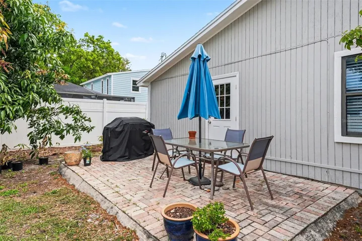 Pavered patio and mango tree