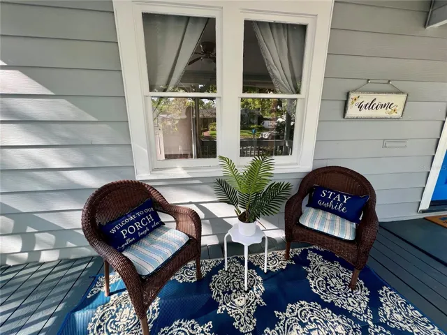 Take your first or last sip of the day on your ample and cozy covered front porch.