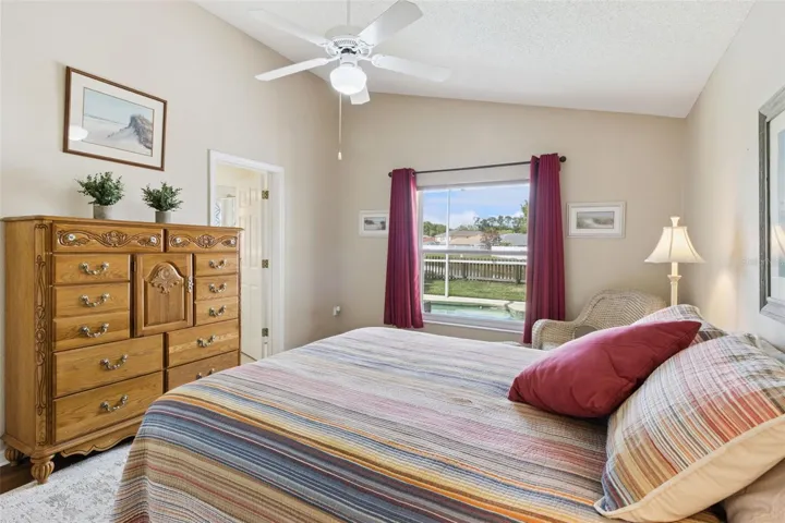 Primary Bedroom Overlooks pool and back yard