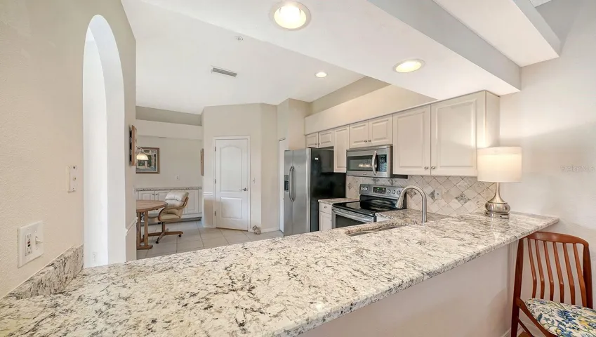 Kitchen has slab granite countertops