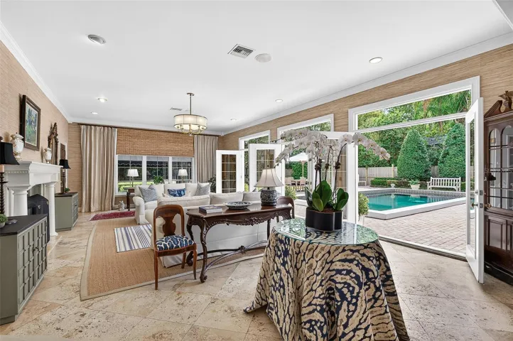 Opens to the pool and Kitchen