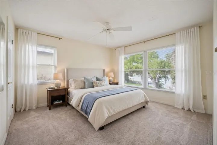 Virtually Staged. Primary Bedroom w/ Lake Views