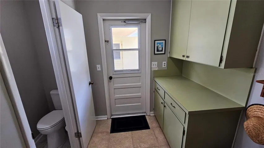 Laundry Room leading outside with half bath