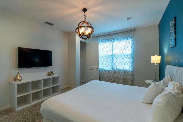 Bedroom 3- Master Suite: King bed, private bathroom, smart TV, Elegant decor, perfect for relaxing.