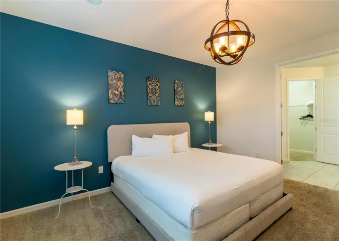 Bedroom 3- Master Suite: King bed, private bathroom, smart TV, Elegant decor, perfect for relaxing.
