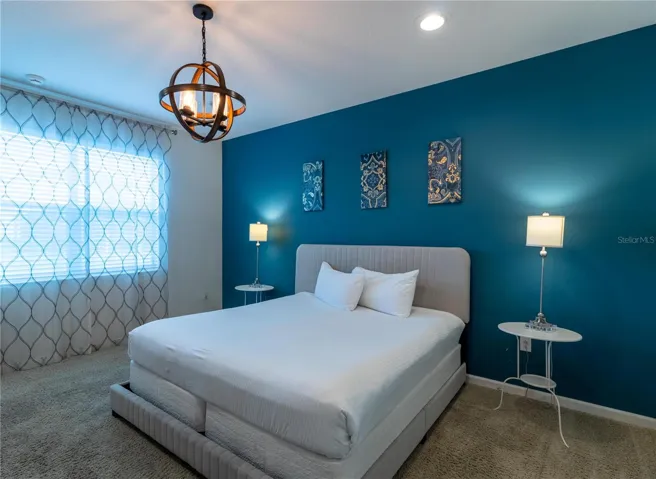 Bedroom 3- Master Suite: King bed, private bathroom, smart TV, Elegant decor, perfect for relaxing.