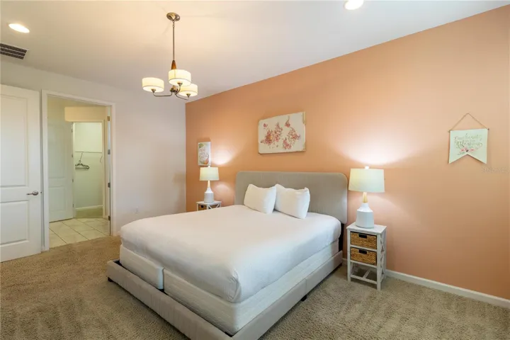 Bedroom 1- Master Suite: King bed, private bathroom, smart TV, Elegant decor, perfect for relaxing.