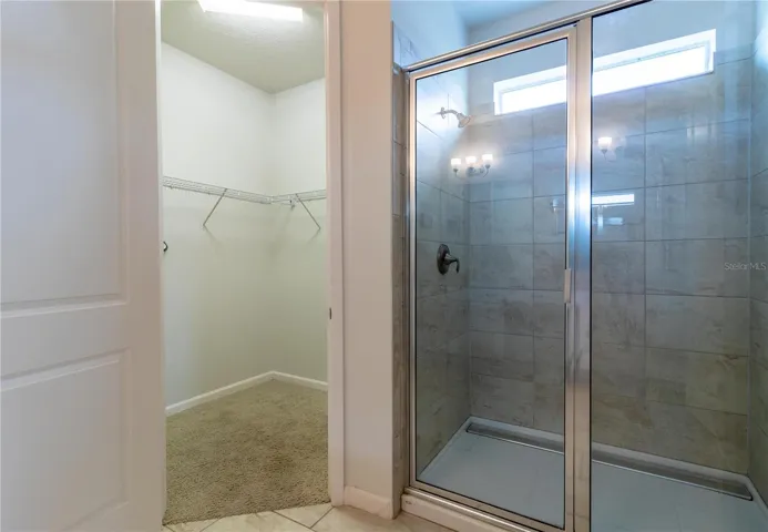 Bathroom 1- Master Suite: Private, en-suite bathroom with double vanity, large shower, and modern fixtures. Luxurius and spacious. Walk in closet