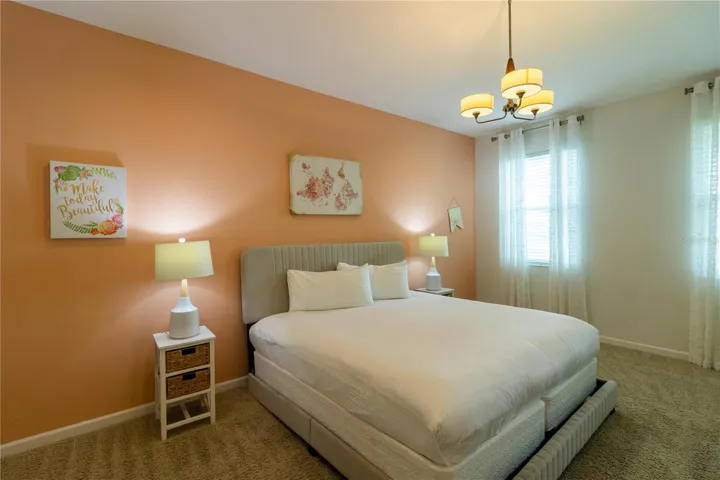 Bedroom 1- Master Suite: King bed, private bathroom, smart TV, Elegant decor, perfect for relaxing.