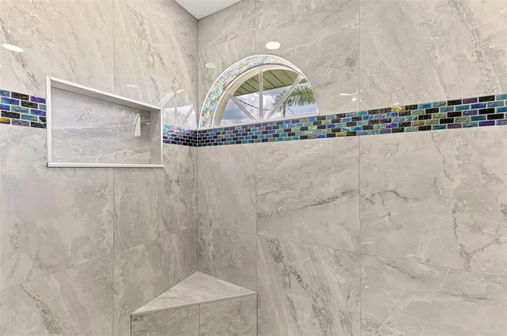 DUAL SHOWER HEAD PRIMARY SHOWER WITH BENCH