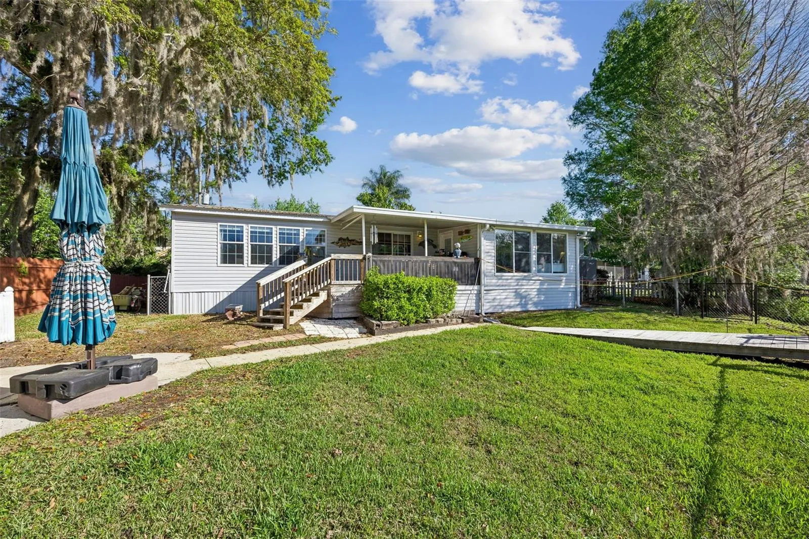 Where there is plenty of room for kids or pets to play in the fenced back yard