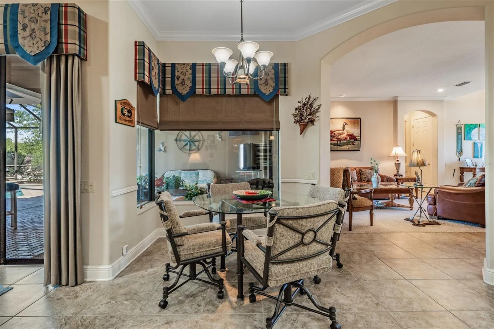 Crown molding throughout with custom window treatments