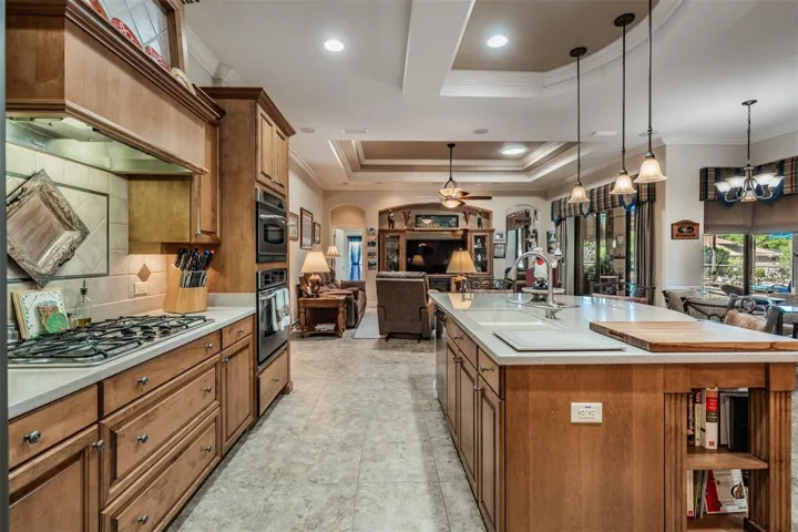 Wood cabinets with vent hood and center island