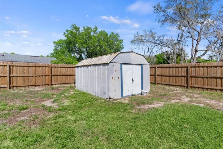 Fully fenced backyard with shed for addtional storage