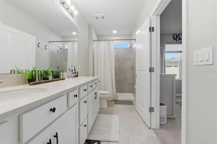 Primary bathroom with double vanity sinks