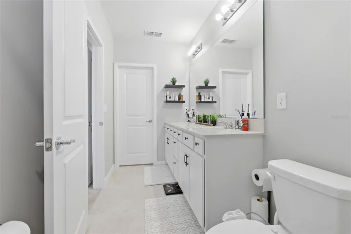 Primary bathroom with double vanity sinks