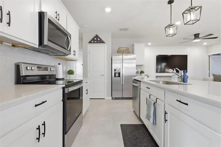 stainless steel appliances with quartz counter tops