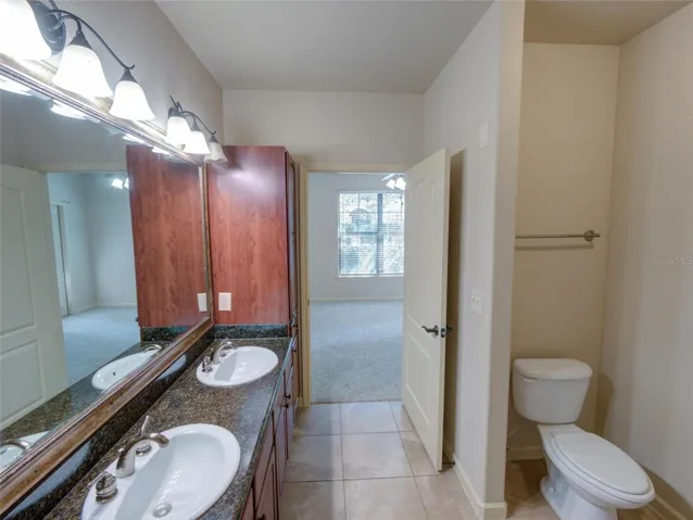Primary Bathroom with Dual Sinks/Granite Counter Tops