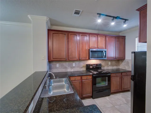 Kitchen with Granite Counter Tops/Upgraded Light Fixtures