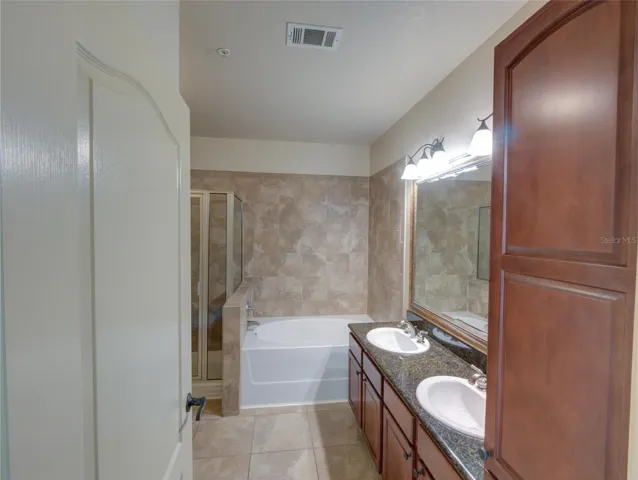 Primary Bathroom with Dual Sinks/Granite Counter Tops