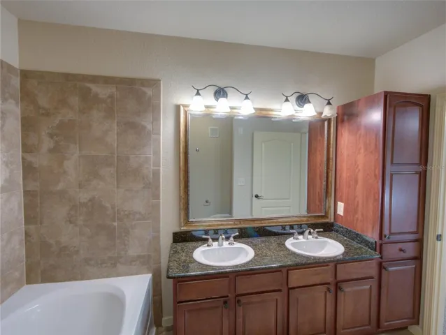 Primary Bathroom with Dual Sinks/Granite Counter Tops