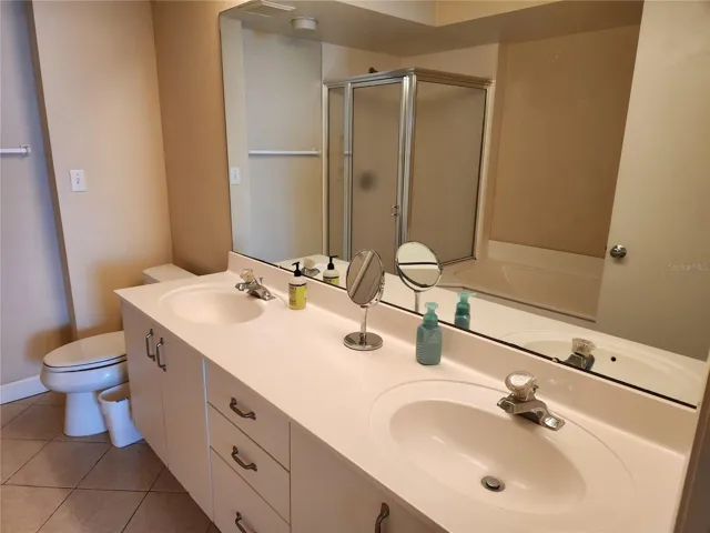Primary Bathroom has separate shower and tub and dual sinks.
