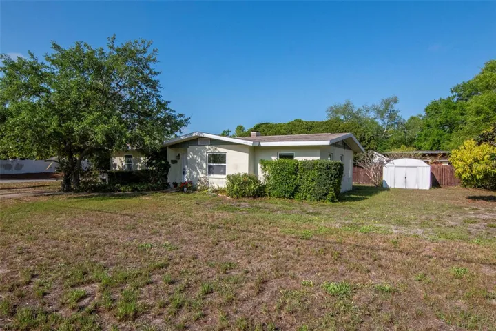 Front of home and large yard.