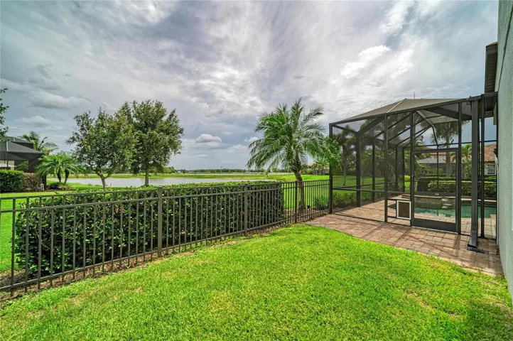 Completely fenced in dog area with convenient doggie door in the lanai