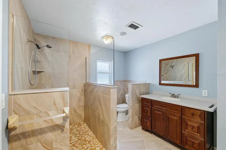 Primary bathroom Dual sinks, walk in tile shower