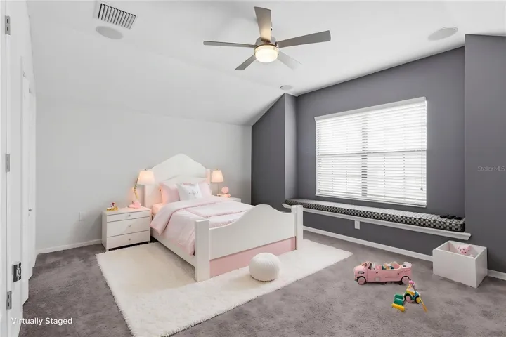 Versatile upstairs bonus room with closet, offering flexibility as a fifth bedroom, home office, media room, or playroom.